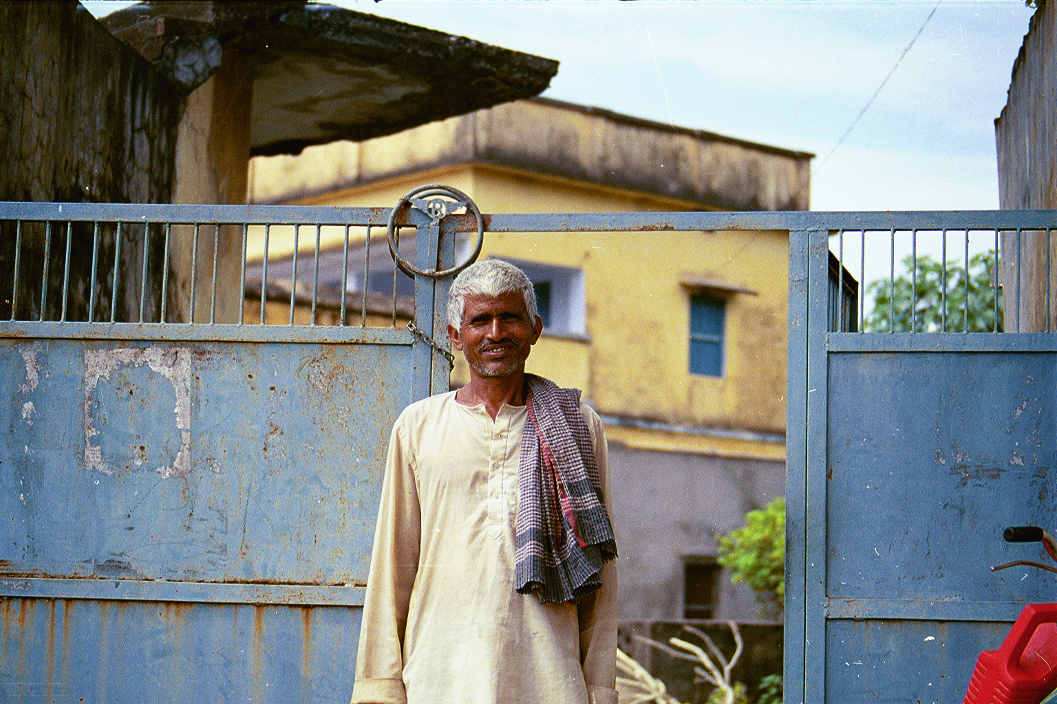 The front of our house; with a local peasant caretaker in Mallehpur, Monghyr(district), North Bihar.